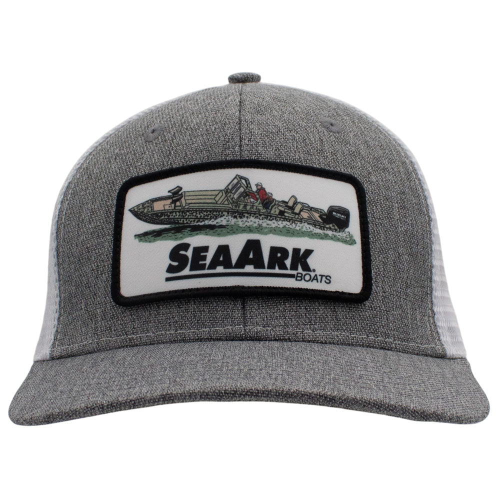 A heather gray trucker hat with a white mesh back and a rectangular embroidered patch on the front.