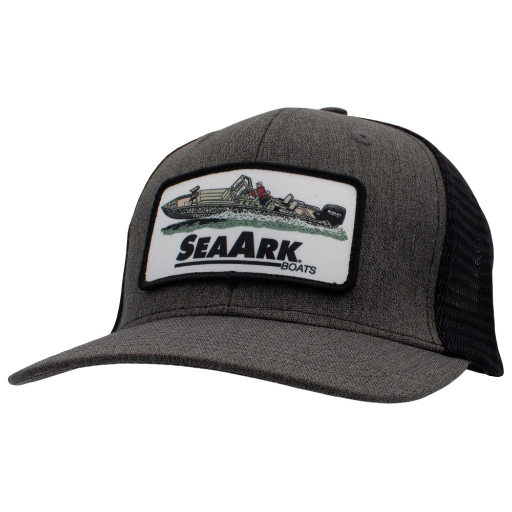 A dark gray heather trucker hat with black mesh back panels and a rectangular front patch featuring a boat illustration and the text 'SEAARK BOATS'.