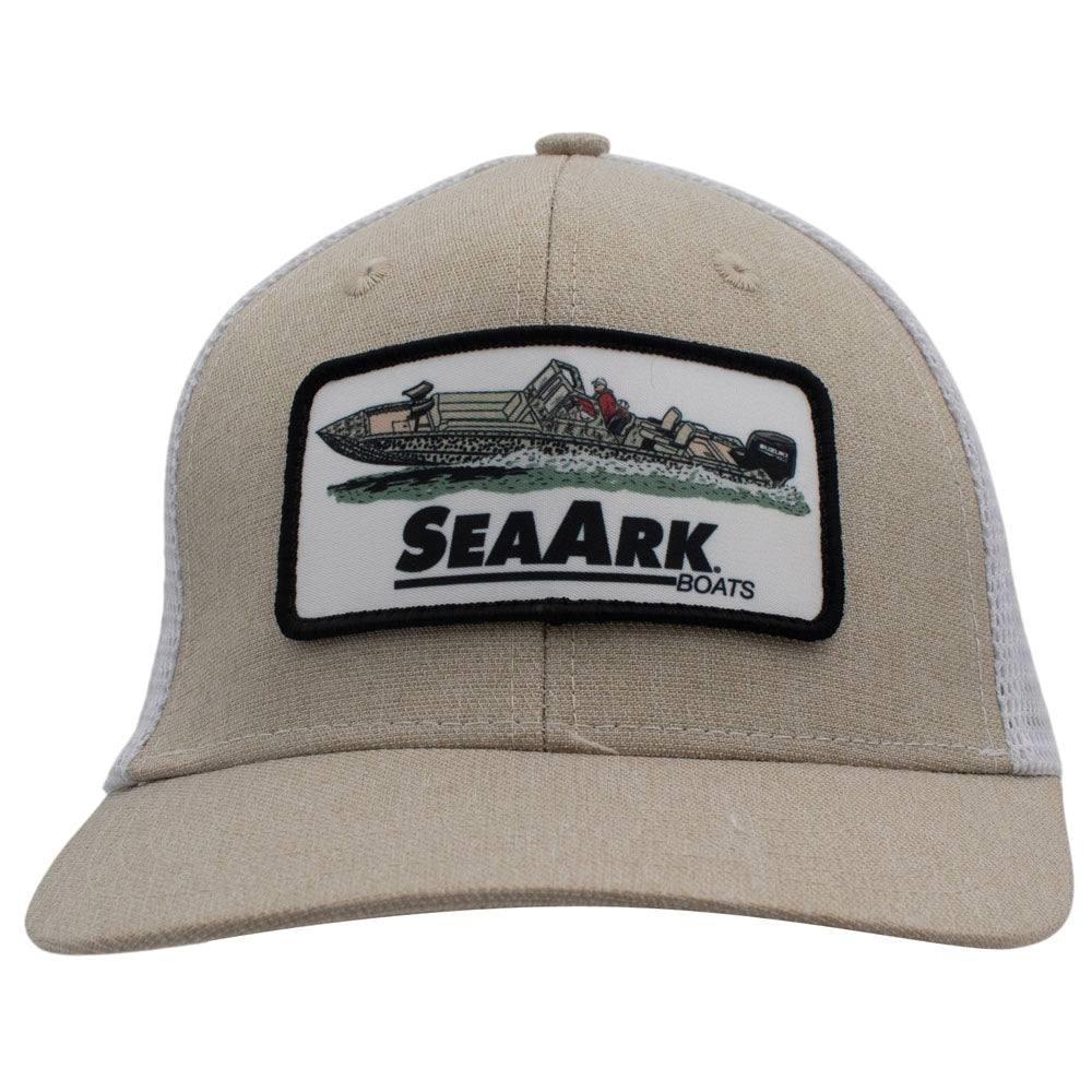 A beige trucker hat with a white mesh back and a rectangular embroidered patch on the front.