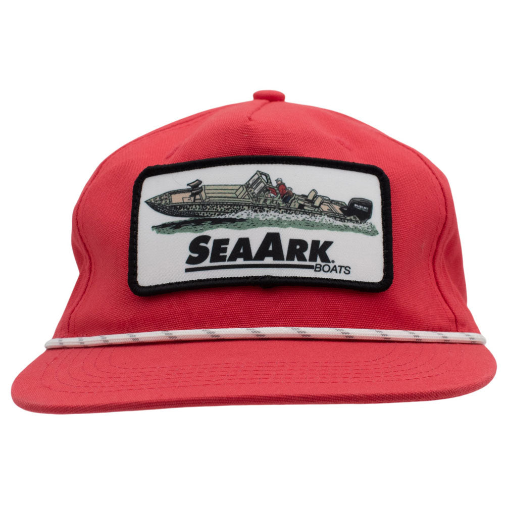 A red flat-brim cap featuring a rectangular embroidered patch on the front with a boat illustration and the text 'SEAARK BOATS'.