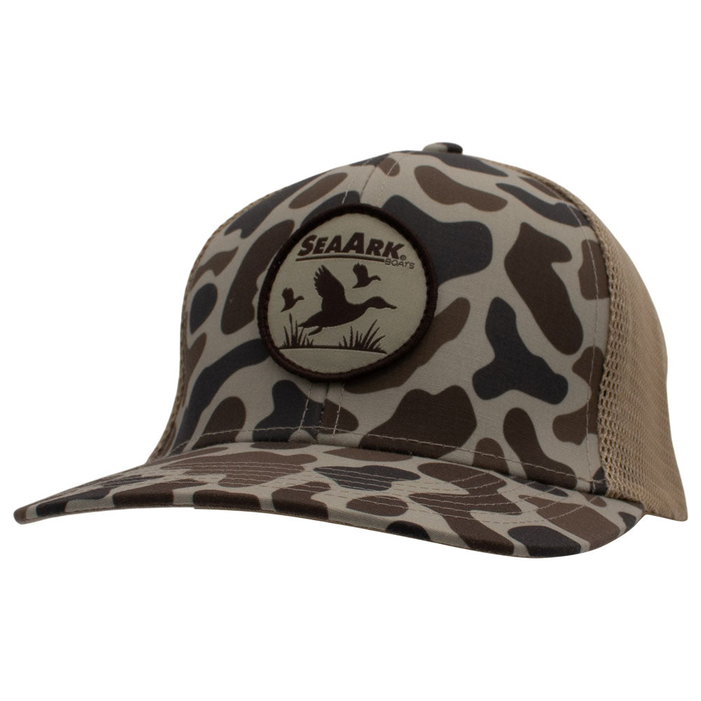 A SeaArk camouflage trucker hat with a curved brim, tan mesh back, and a circular front patch featuring duck silhouettes.