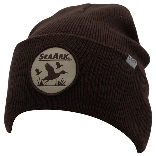A dark brown ribbed knit beanie hat featuring a circular SeaArk logo patch on the front fold and a small white 'Lost' tag on the side, shown against a plain white background.