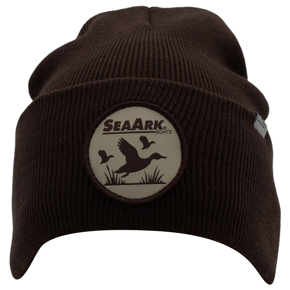 A dark brown ribbed knit beanie hat featuring a circular SeaArk Boats duck logo patch on the front, set against a plain white background.