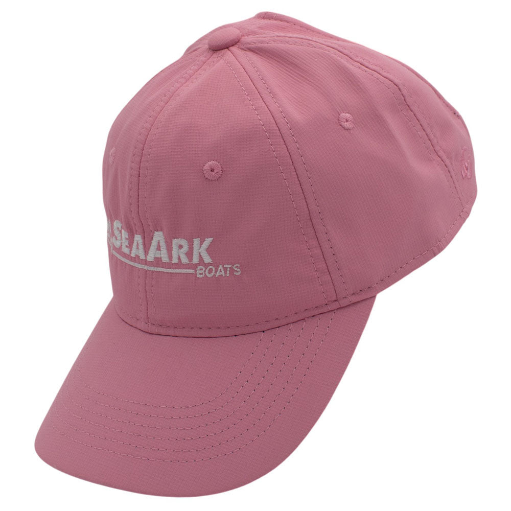 Side of a pink baseball cap with a white logo embroidered on the front.