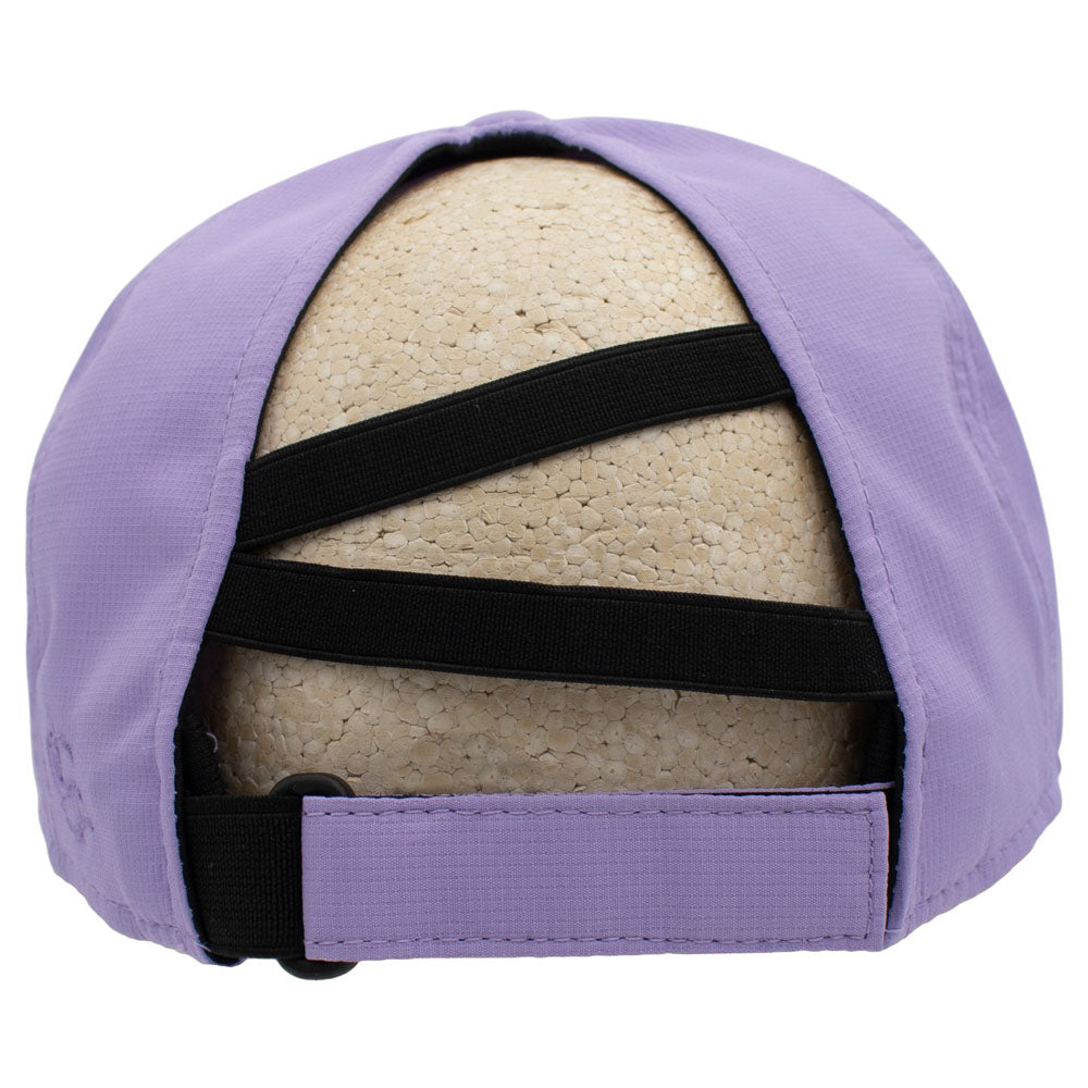 Back of a purple baseball cap with a unique crisscross strap designed for ponytails, displayed on a beige foam mannequin head against a white background.