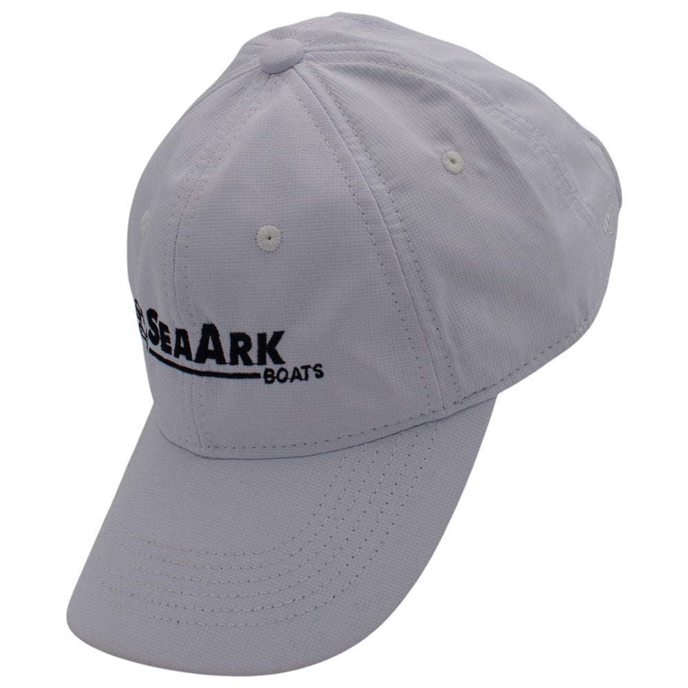 Side of a white baseball cap with a black logo embroidered on the front.