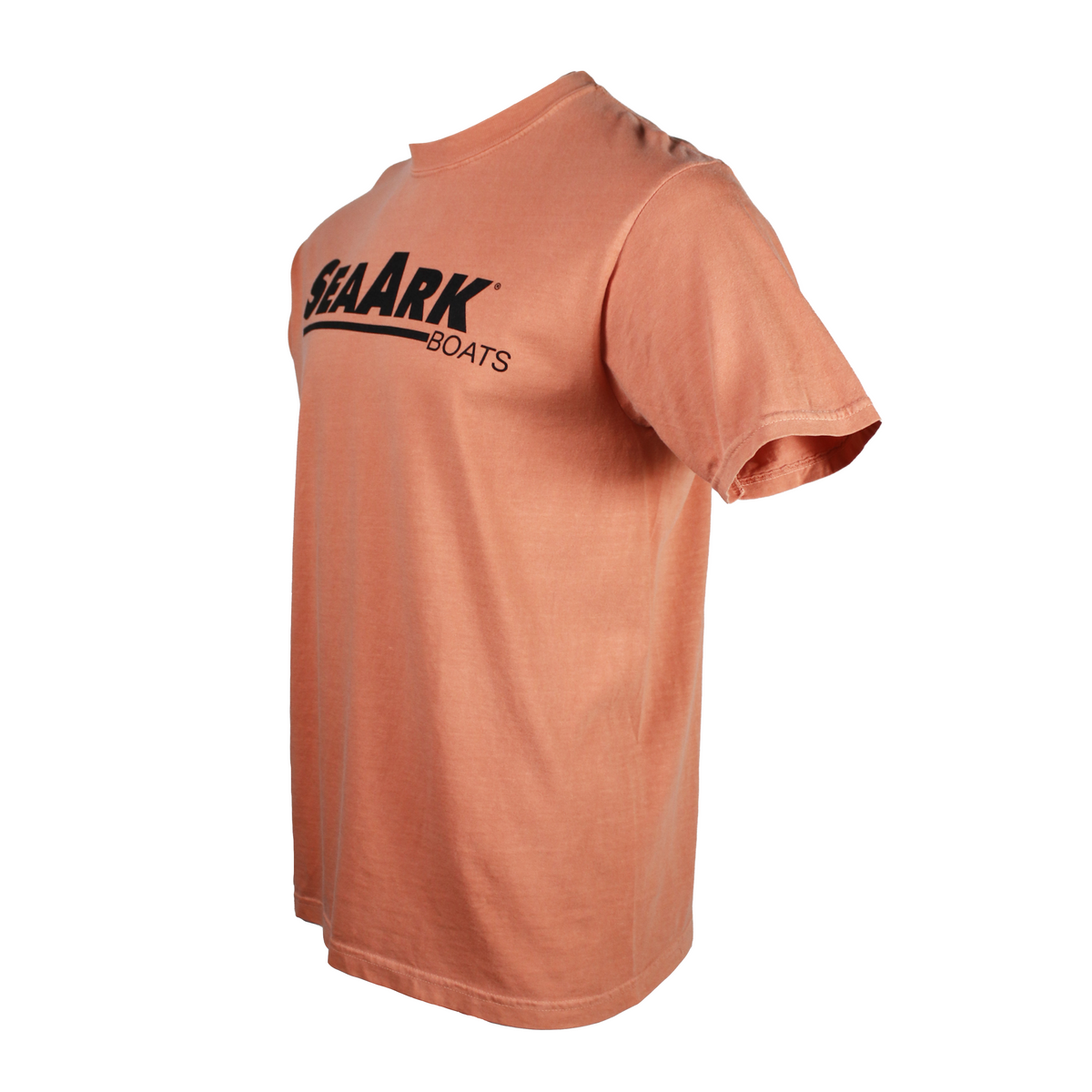Side of a pale orange tee with a large black logo on the chest.
