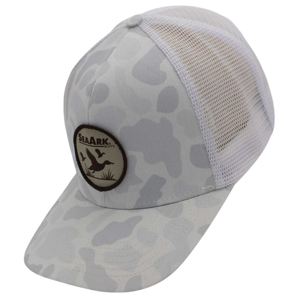 Side of a trucker-style cap with a white mesh back and a front panel/brim featuring a white organic camouflage pattern.